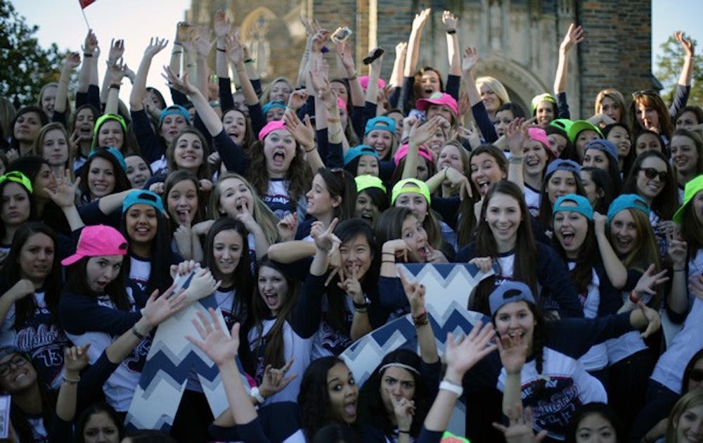 Members of Alpha Phi sorority celebrate the addition of new members on Panhellenic sorority Bid Day Sunday afternoon.