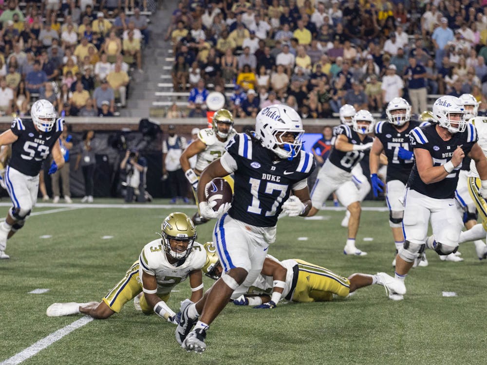 Running back Star Thomas runs around Georgia Tech's defense.