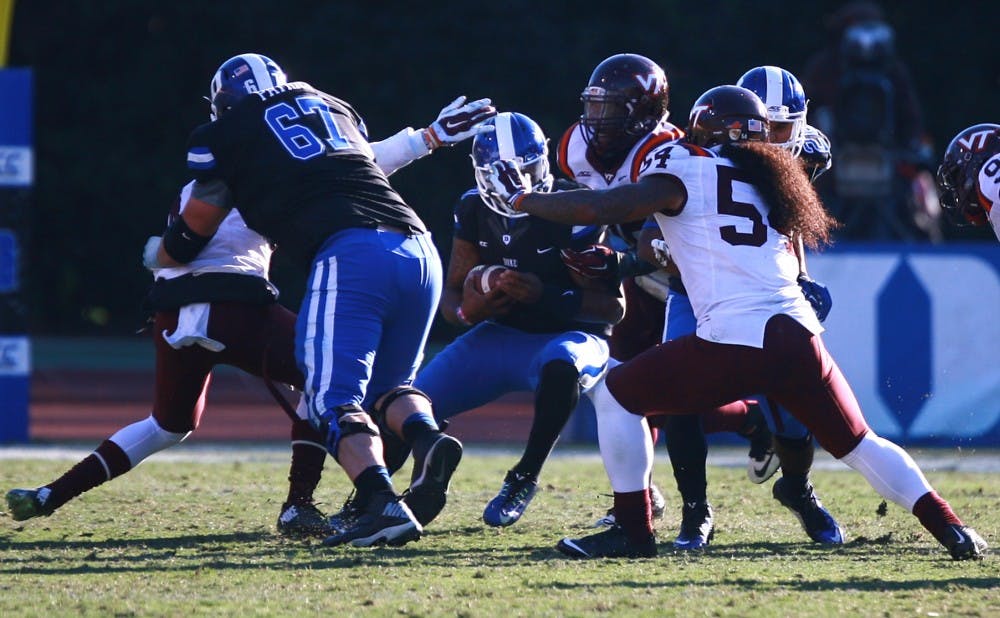 Quarterback Anthony Boone was under heavy duress all afternoon as the Hokie defense racked up four sacks and nine tackles for loss.