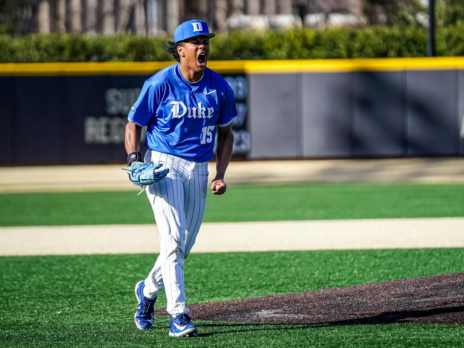 Freshman pitcher Kyle Johnson celebrates as he leaves the mound during Duke's upset of Wake Forest.
