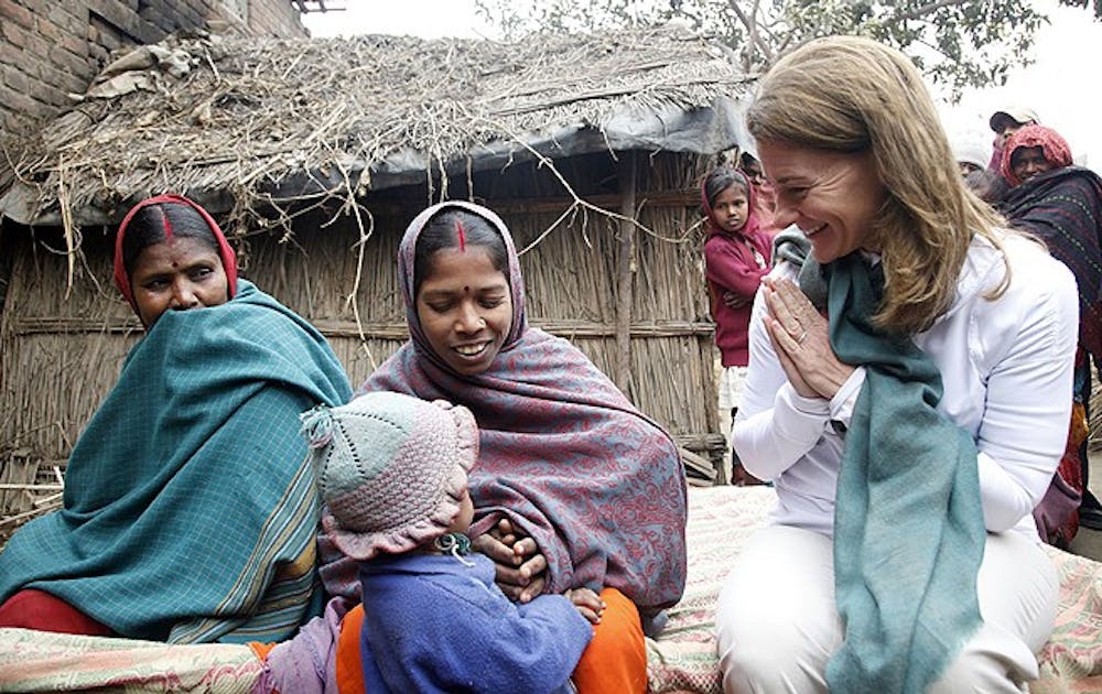 India / Bihar / Patna district / January 24, 2013Melinda Gates interacts with Sharmila Devi (centre), who has recently given birth to a girl (carried under her shawl), at her home in Dedaur village in Bakhtiarpur block of Patna district. On Sharmila Devi's right is her mother-in-law, Lal Muni Devi.