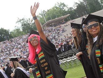 Graduates of the Class of 2012 attend the commencement ceremony in Wallace Wade Stadium Sunday.