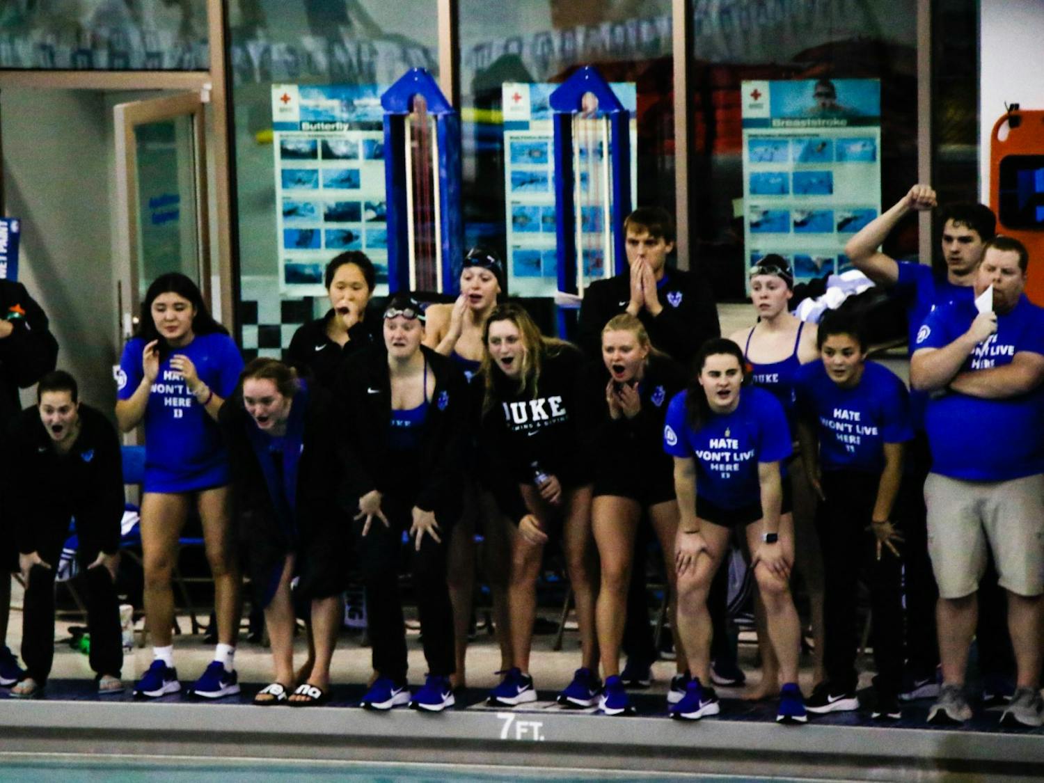 Duke swimmers cheer on their teammates against South Carolina in November.