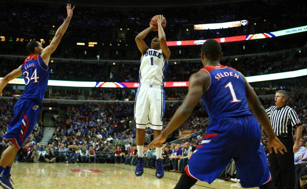 Jabari Parker scored a game-high 27 points, but the Blue Devils fell to Kansas 94-83 in Chicago.