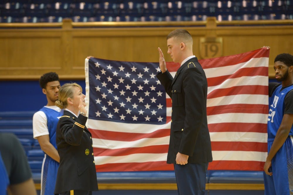 Duke center Marshall Plumlee takes part in his contracting ceremony Friday before practice. | Special to The Chronicle