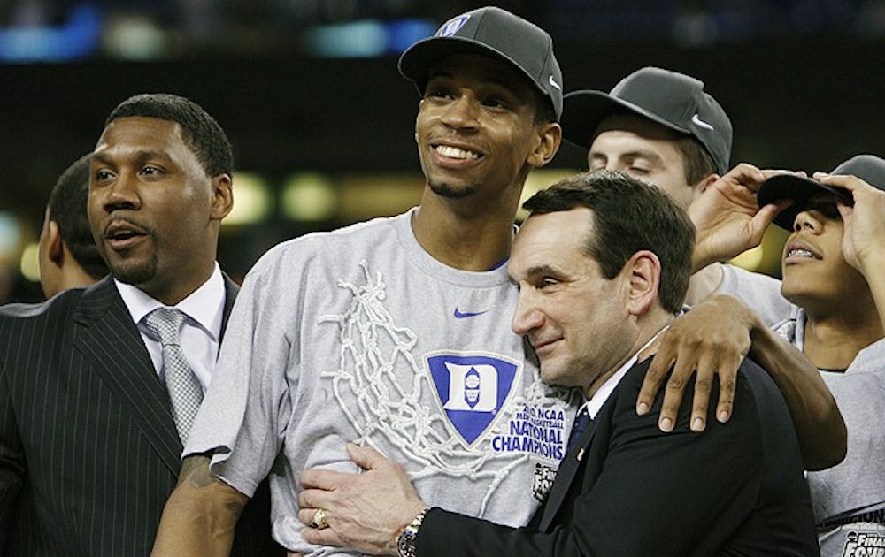 Photos from Duke's National Championship Victory over Butler. Duke survived a late run by Butler to win their fourth National Championship 61-59.