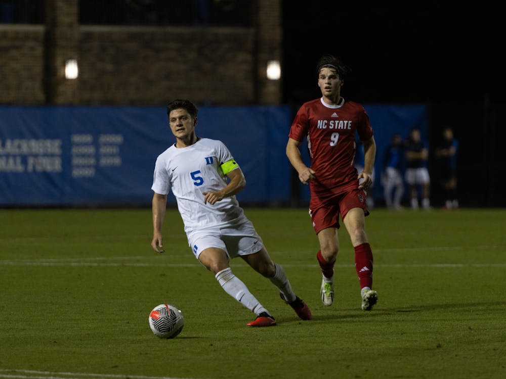 Antino Lopez takes the ball away from an N.C. State player during Duke's Friday evening win.