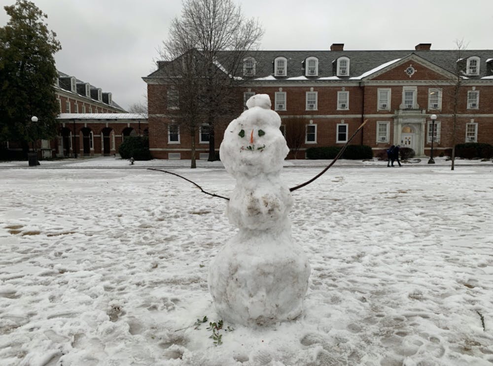 A snowman smiles on East Campus.