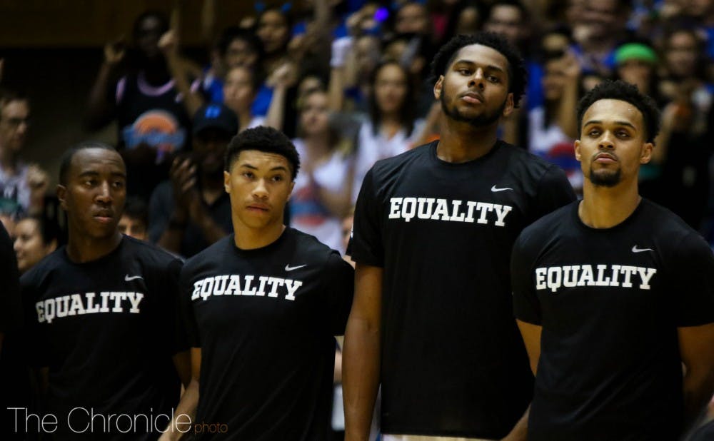 The Blue Devils donned shirts with the word "Equality" when they came out of the locker room just before tip-off.