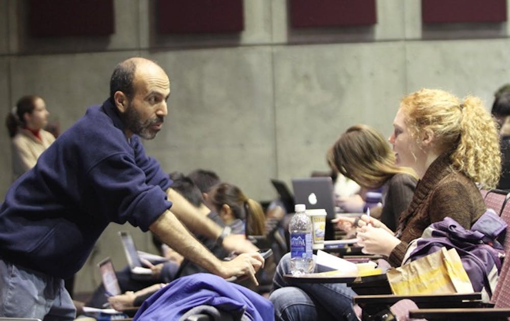 <p>Professor of Biology Mohammed Noor tests out a new "flipped classroom" format, in which students watch lectures pre-recorded on Coursera at home and complete problem sets in class.</p>