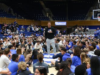 Head coach Jon Scheyer speaks to students before Thursday night's tenting test inside Cameron Indoor Stadium.