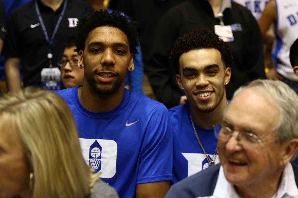 Former Blue Devils Jahlil Okafor and Tyus Jones had a close-up view of Grayson Allen's buzzer-beater Saturday against No. 7 Virginia.