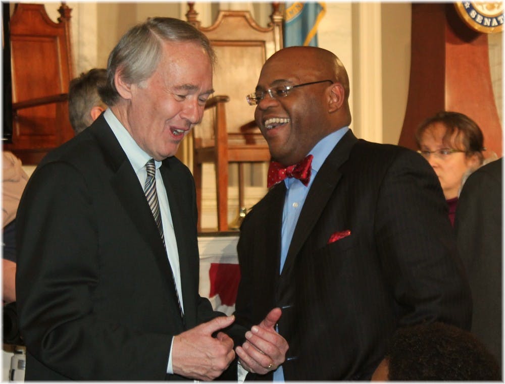 Sen. Mo Cowan, Trinity '91,(r) chats with Rep. Ed Markey, D-Mass. at an event celebrating the career of John Kerry.