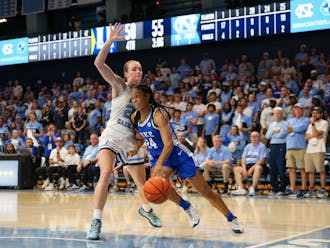 Reigan Richardson drives to the basket during Duke's regular-season finale at North Carolina.