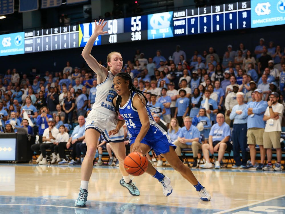 Reigan Richardson drives to the basket during Duke's regular-season finale at North Carolina.