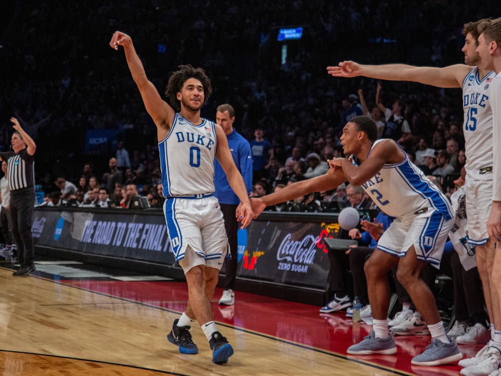 <p>Freshman guard Jared McCain celebrates another make from behind the arc in Duke's victory against James Madison.&nbsp;</p>