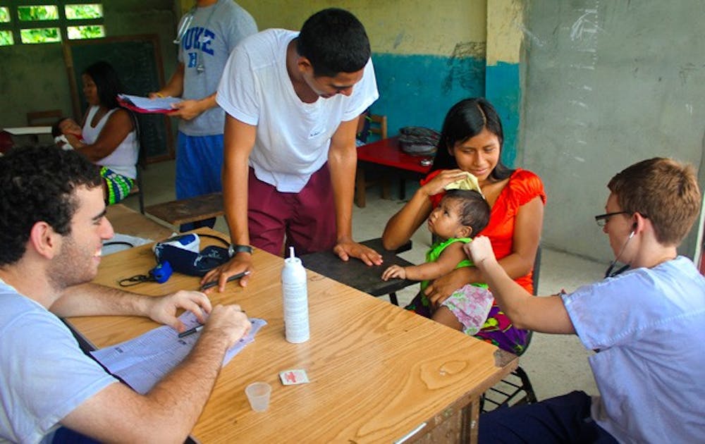 Students examine a patient in Panama, where Duke Global Brigades treated 385 people this summer as part of their ongoing goal to decrease health care disparities around the world.