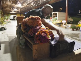 Vendors arrive at the Durham Central Park market before sunrise to set up their stands and arrange produce. For Helga and Tim, each Saturday morning consists of a precisely articulated set-up routine in preparation for their many customers.