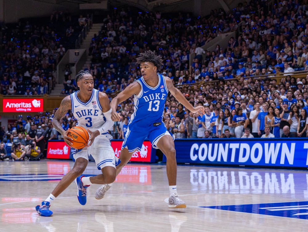 <p>Cameron Sheffield (13) guards Isaiah Evans in Duke's Countdown to Craziness.</p>