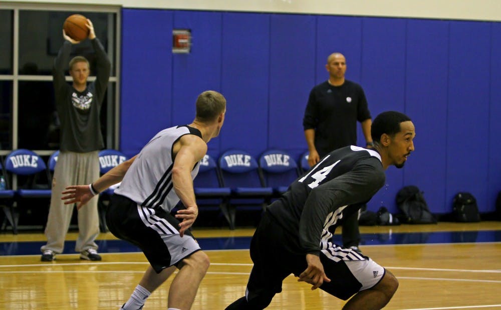 Shaun Livingston goes through drills next to former Blue Devil Mason Plumlee, now teammates on the Brooklyn Nets.