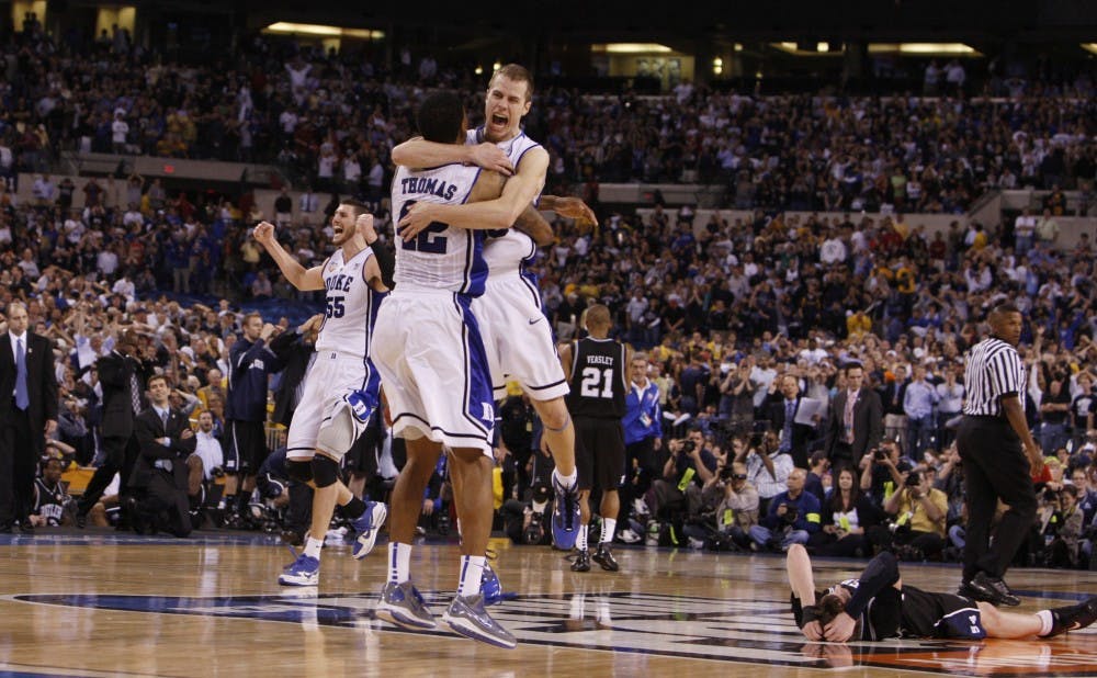Scheyer and co-captain Lance Thomas celebrate as the buzzer sounds to signal Duke's 61-59 win over Butler in the 2010 national championship game in Indianapolis.