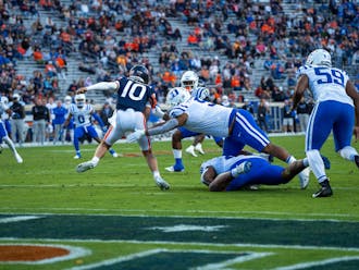 Ja'Mion Franklin extends to sack Anthony Colandrea during Duke's loss to Virginia.