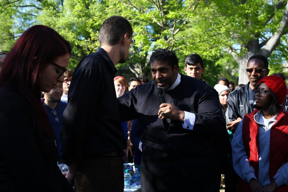 <p>Rev. William Barber II,&nbsp;president of the North Carolina chapter of the NAACP,&nbsp;visited protestors in front of the Allen Building Tuesday.</p>