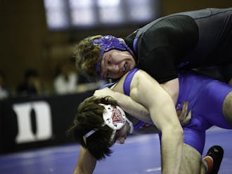 Redshirt senior Conner Hartmann needed just 50 seconds to send off his opponent Sunday against American as the Blue Devils picked up a pair of wins.