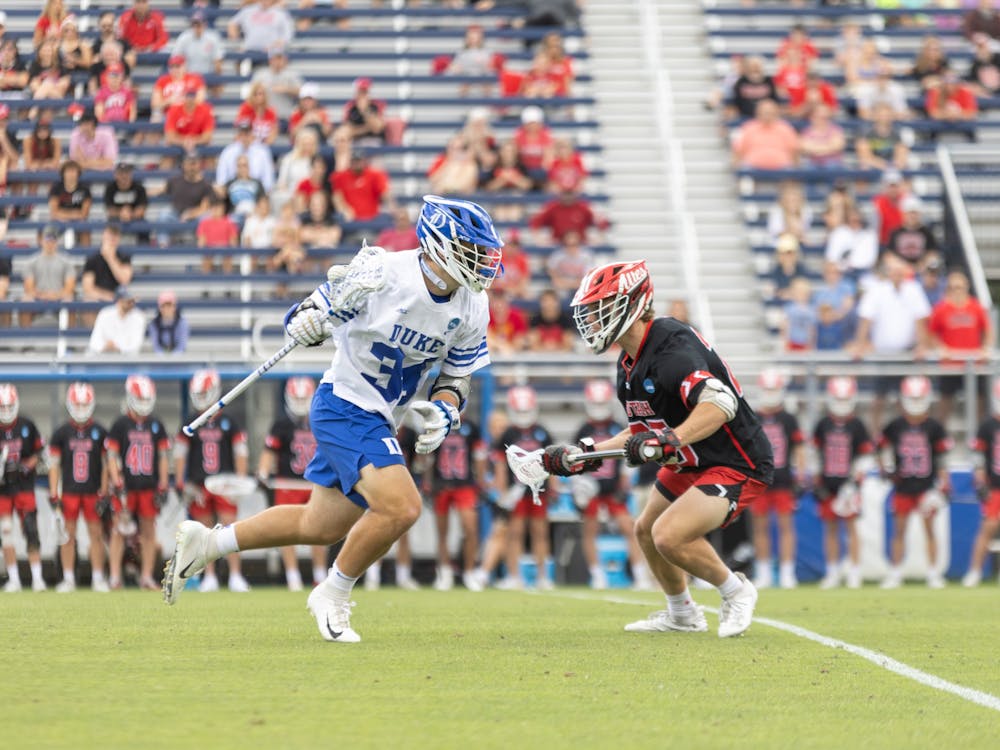 Senior attack Brennan O'Neill attacks the defense in Duke's NCAA tournament win against Utah.