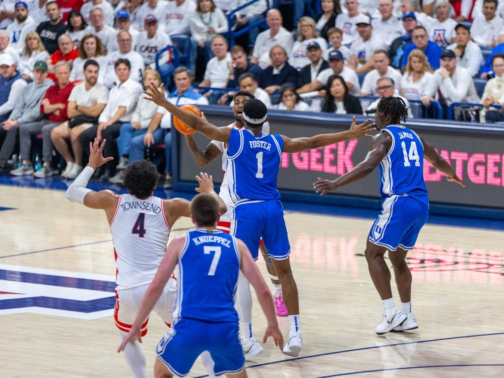 Duke's defenders guard Arizona in the Blue Devils' 69-55 win. 