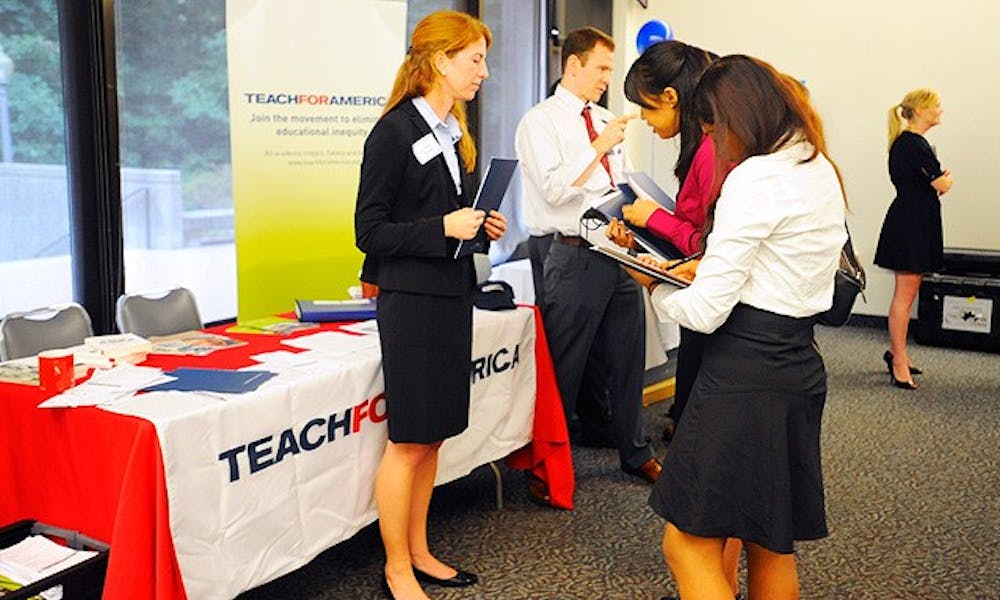 Students speak with recruiters for Teach for America at a career fair in Von Canon in the Bryan Center. The program pairs graduates from the nation’s top schools with underperforming schools throughout the country.
