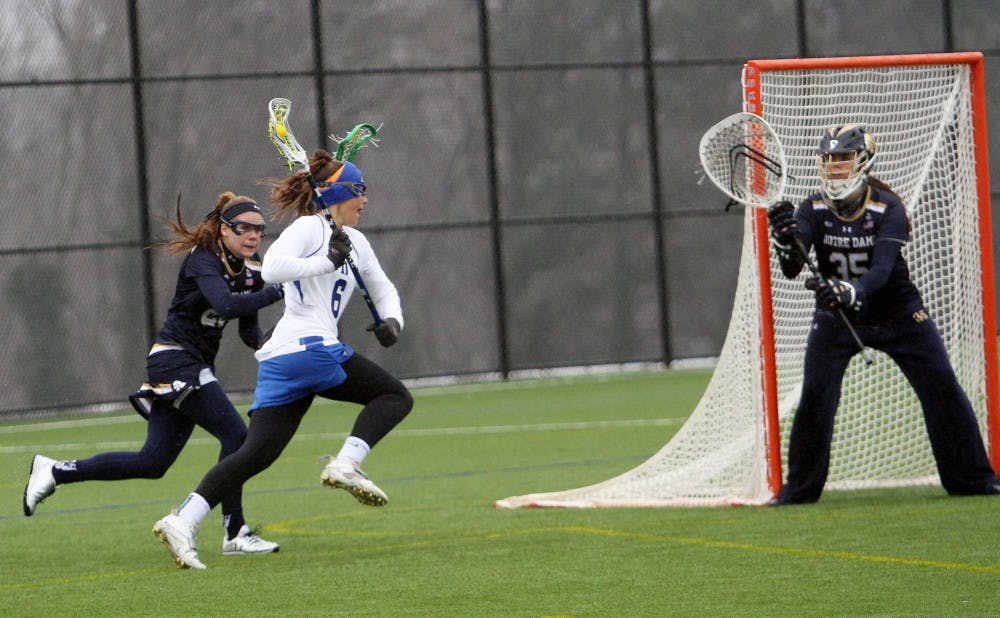Senior Brigid Smith tied a career-high with four assists in Thursday's 14-7 quarterfinal win against Louisville.