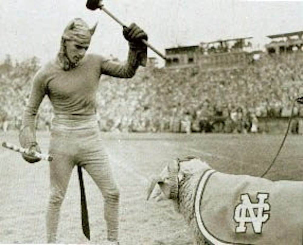 Ramses, the mascot for North Carolina, squares off with the Blue Devil before the 1957 football game. 