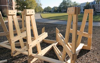 Basset residents build a new bench on East Campus. Because of recent destructive pranks, administrators are cracking down on students who damage benches.