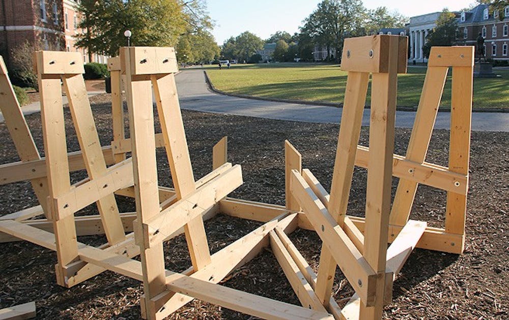 Basset residents build a new bench on East Campus. Because of recent destructive pranks, administrators are cracking down on students who damage benches.