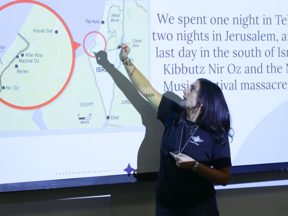 <p>Senior Alanna Peykar points to a map depicting communities near the Gaza Strip.&nbsp;</p>
