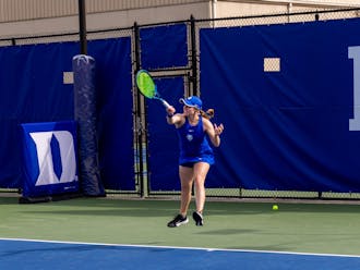 Brianna Shvets hits a forehand for Duke women's tennis. 