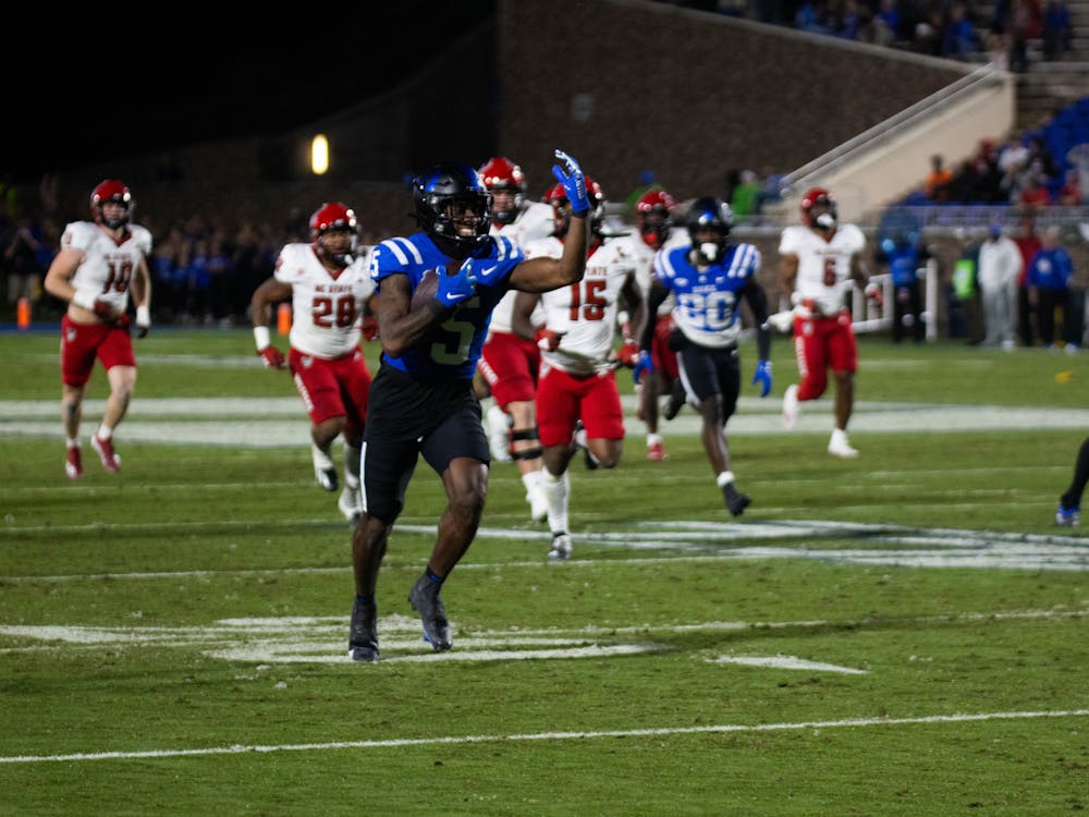 Jalon Calhoun rushes with the ball during Duke's win against N.C. State.
