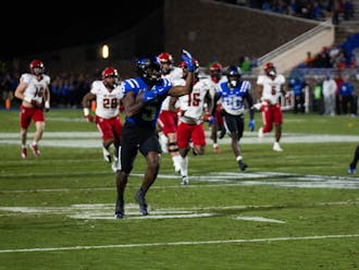 Jalon Calhoun rushes with the ball during Duke's win against N.C. State.