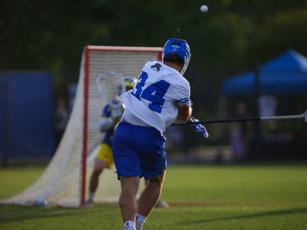 <p>Junior attackman Brennan O'Neill releases a shot in Duke's opening-round win against Delaware.</p>