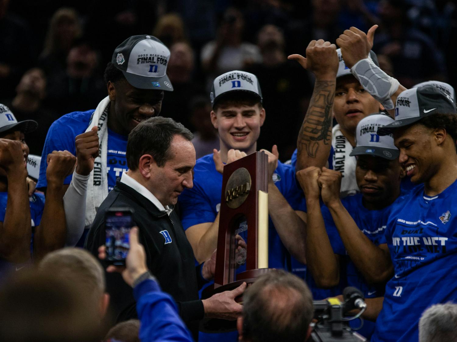 coach k holds trophy 3