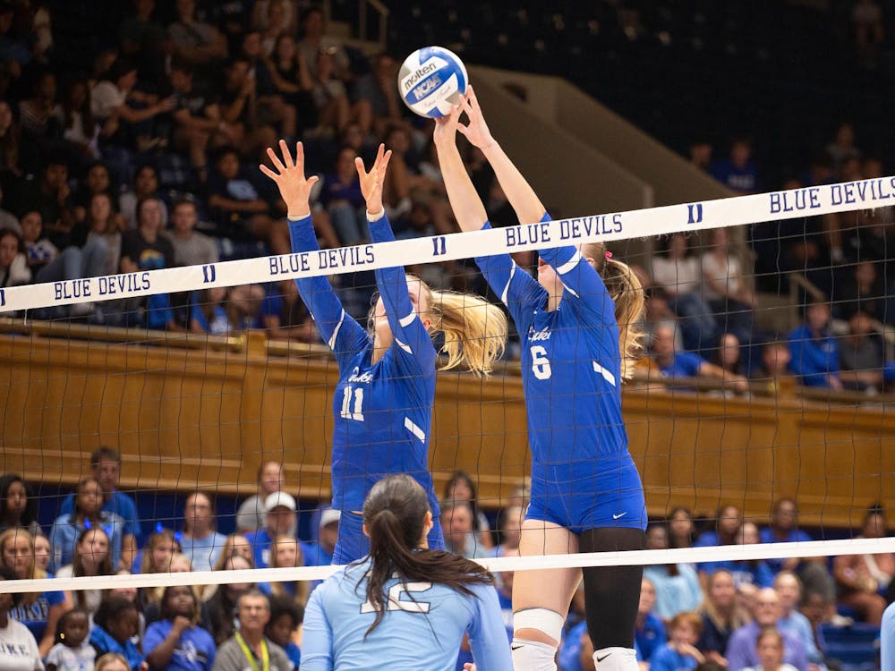 Rylie Kadel and Kerry Keefe block an opposing shot. 