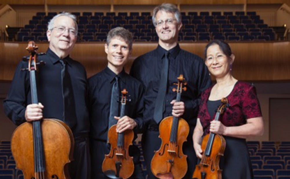 <p>The Ciompi Quartet­—comprised of Eric Pritchard, Hsiao-mei Ku, Jonathan Bagg and Fred Raimi—smiles with their instruments, two violins, a viola and cello.</p>