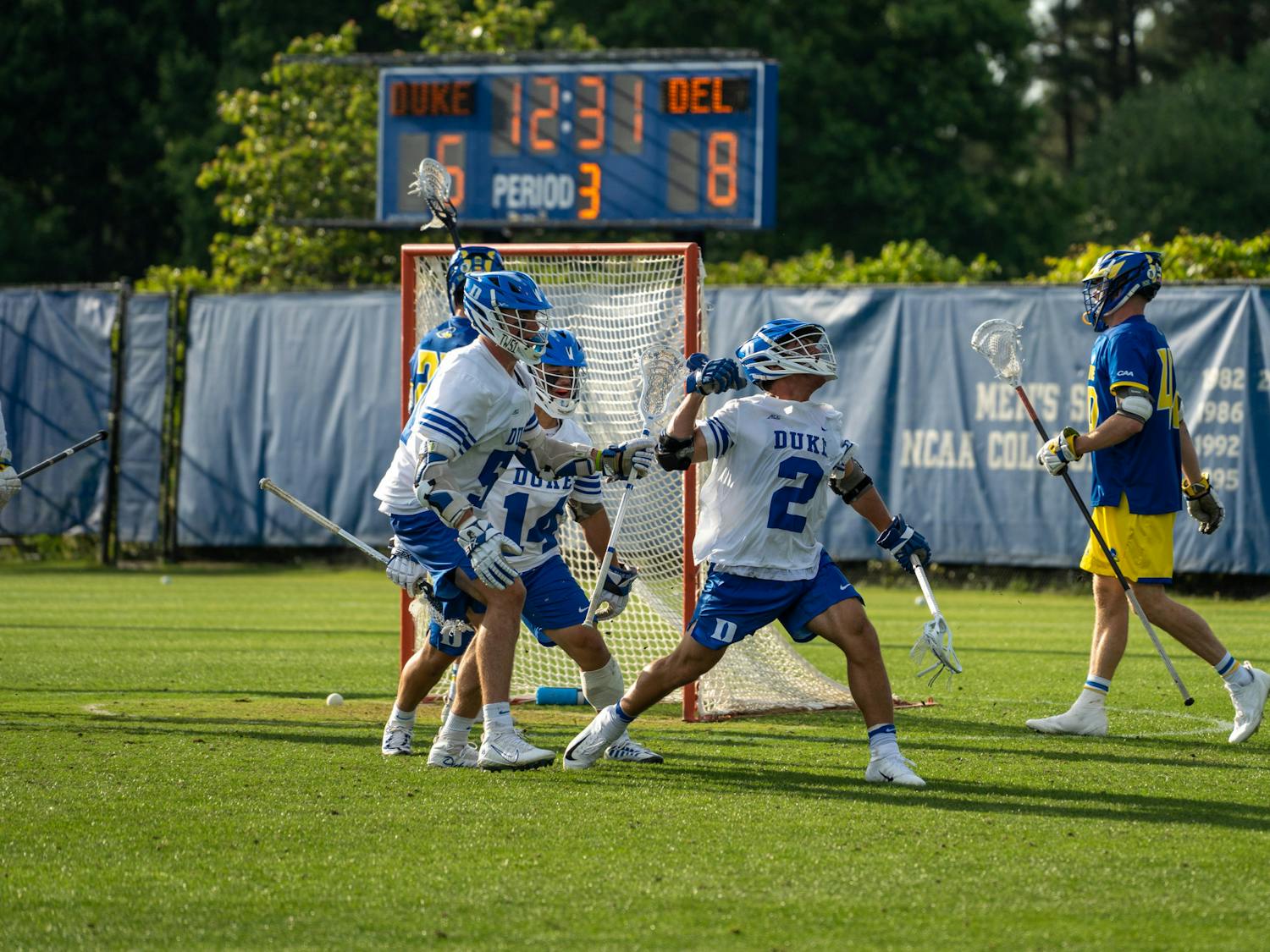 Sophomore attacker Andrew McAdorey (right) celebrates during Duke's opening-round victory against Delaware.