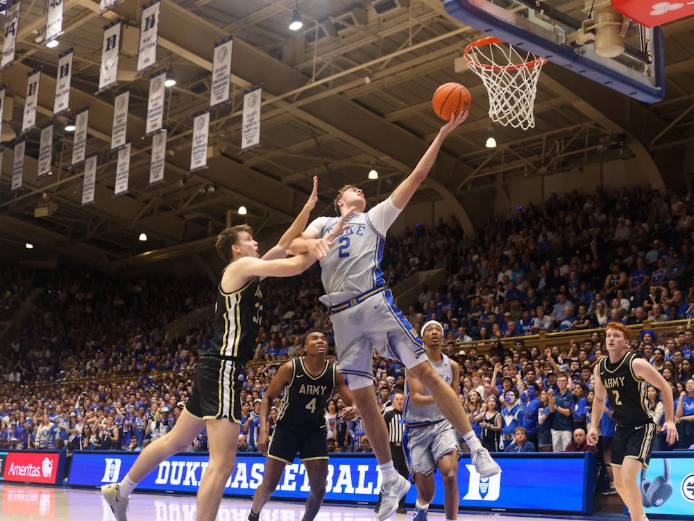 Cooper Flagg stretches out for a tough layup in Duke's 100-58 win against Army Friday night. 