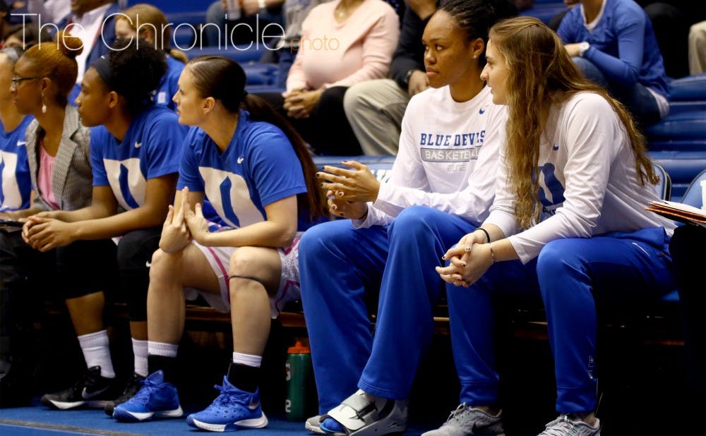 Azurá Stevens (second from right) and Haley Gorecki (right) are two of the several Blue Devils to miss significant time this season due to injury.