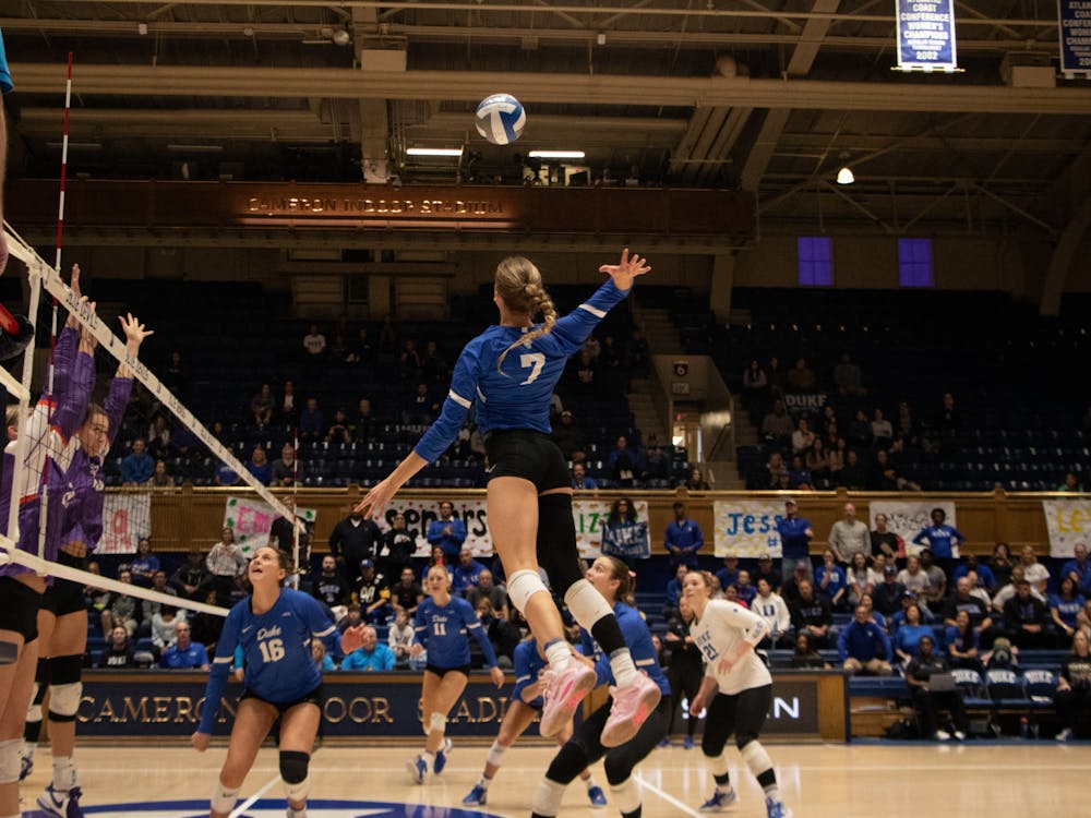 Gracie Johnson leaps up to spike the ball during Duke's Sunday win against Clemson.