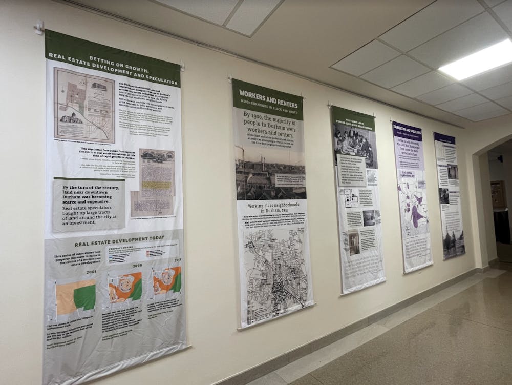 The Uneven Ground exhibit is still displayed on the second floor of the Classroom Building.&nbsp;