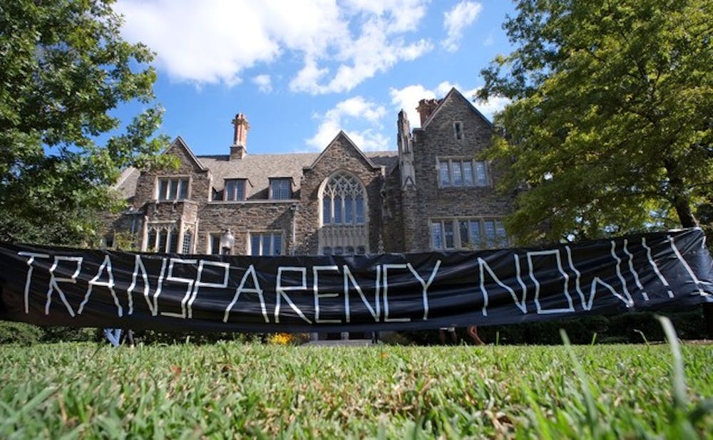 The student coalition DukeOpen used a banner in front of the Allen Building in Fall 2013 as part of its campaign to increase transparency of University investments. | Chronicle File Photo