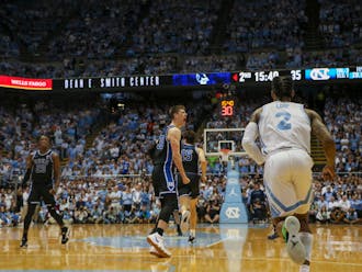 Kyle Filipowski (center) shows some emotion during the second half of Duke's win at North Carolina.